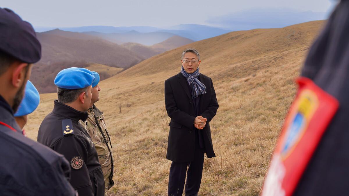 peacekeepers standing in field for rememberance event