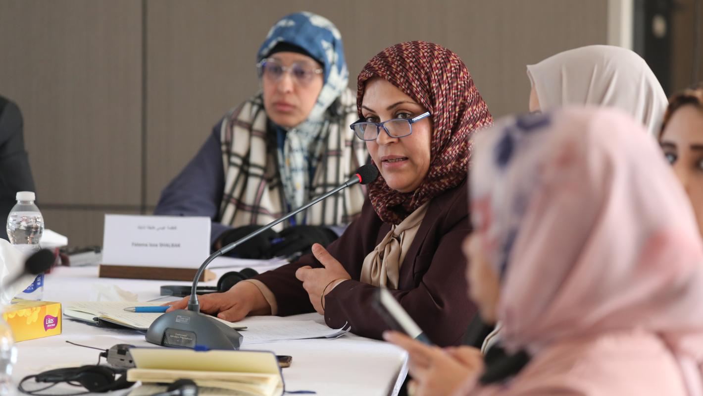 Members of the national reconciliation track of the structured dialogue in a meeting 