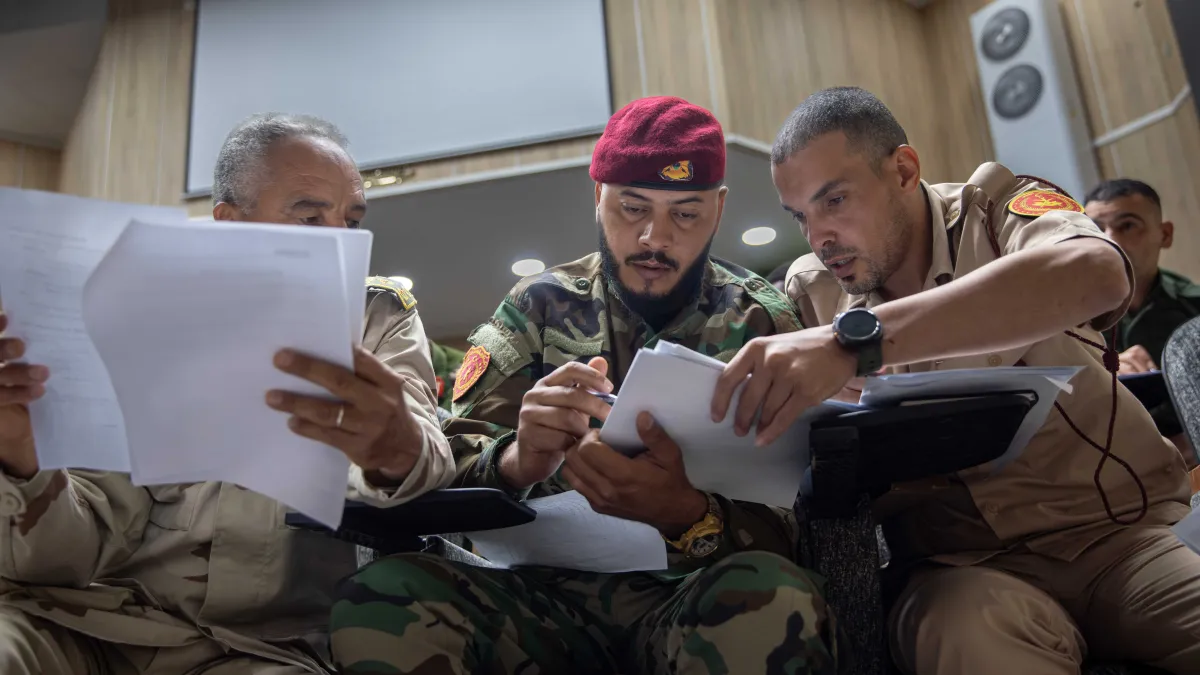 Officers learn about weapons and ammunition management in a classroom at the Ministry of Defence