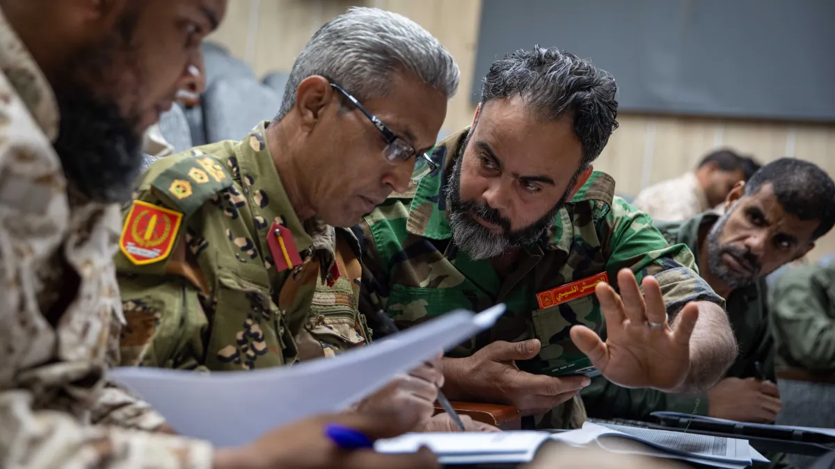 Officers learn about weapons and ammunition management in a classroom at the Ministry of Defence