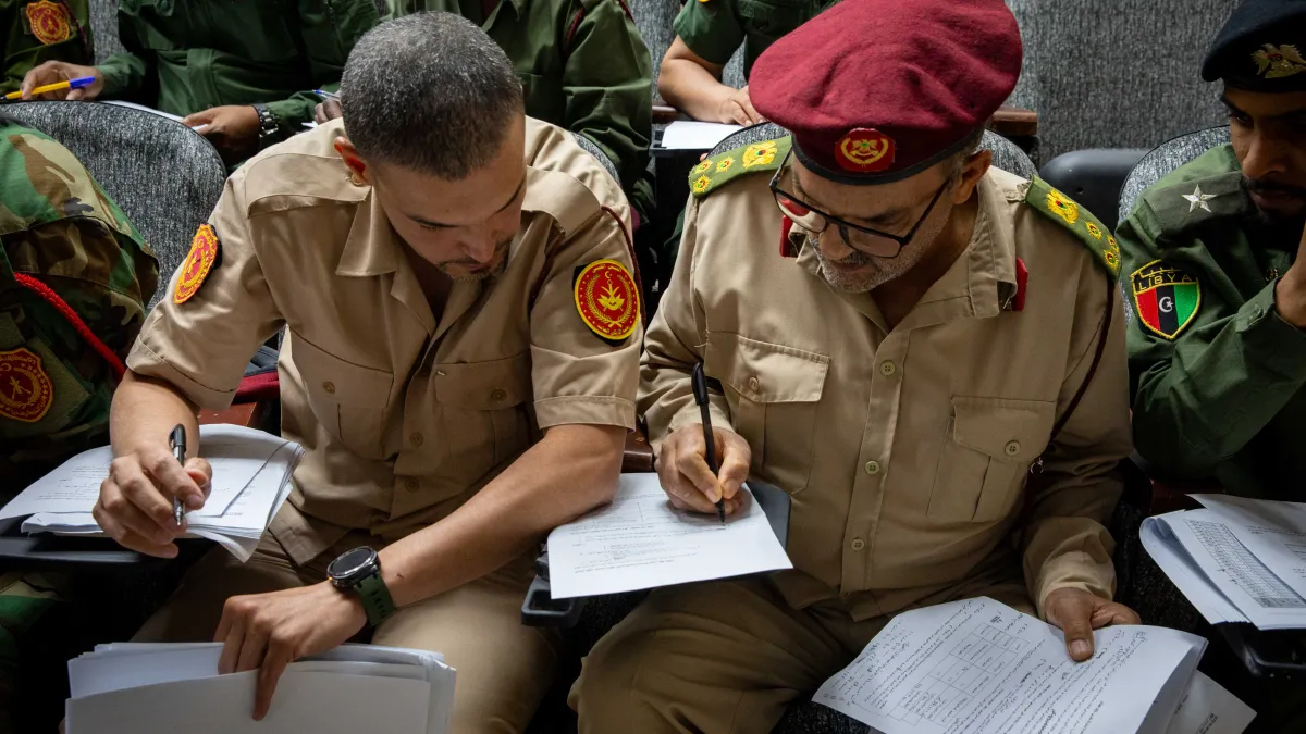 Officers learn about weapons and ammunition management in a classroom at the Ministry of Defence