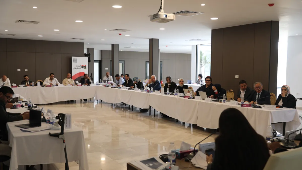 A view of the Governance Track members sitting around a table, discussing.