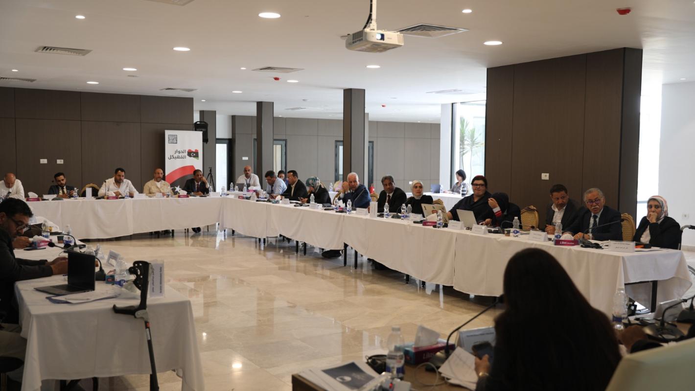 A view of the Governance Track members sitting around a table, discussing. 