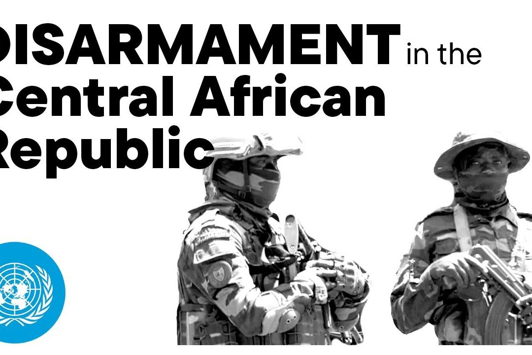 Two men in uniform carrying weapons.