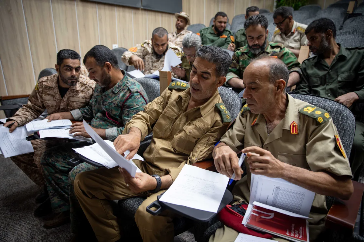 Officers learn about weapons and ammunition management in a classroom at the Ministry of Defence