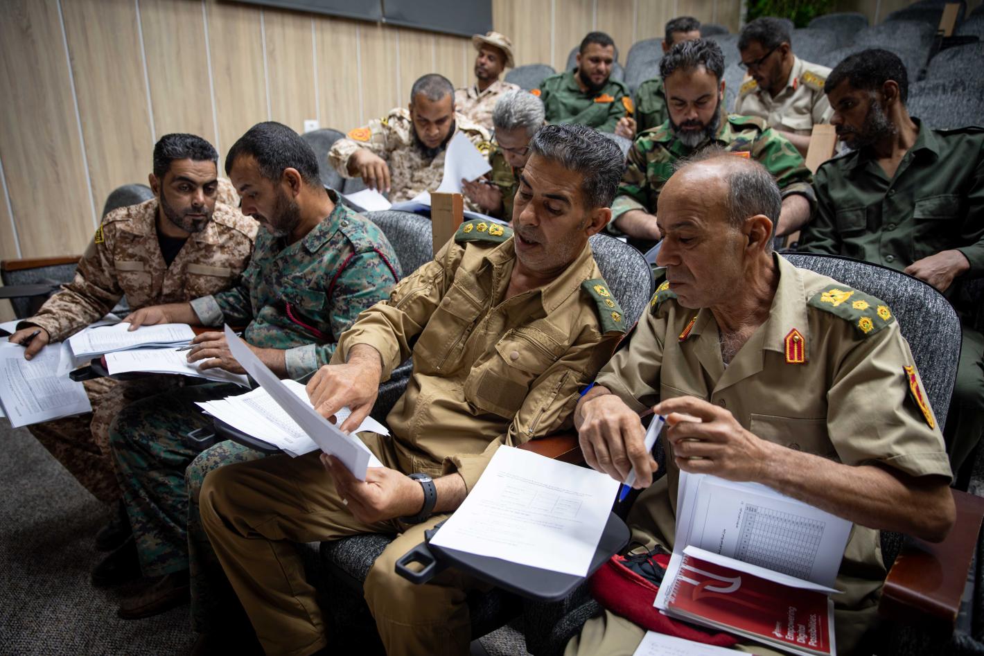 Officers learn about weapons and ammunition management in a classroom at the Ministry of Defence