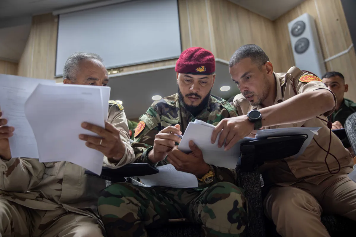 Officers learn about weapons and ammunition management in a classroom at the Ministry of Defence