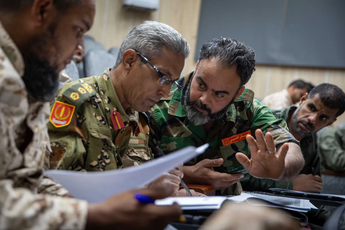 Officers learn about weapons and ammunition management in a classroom at the Ministry of Defence
