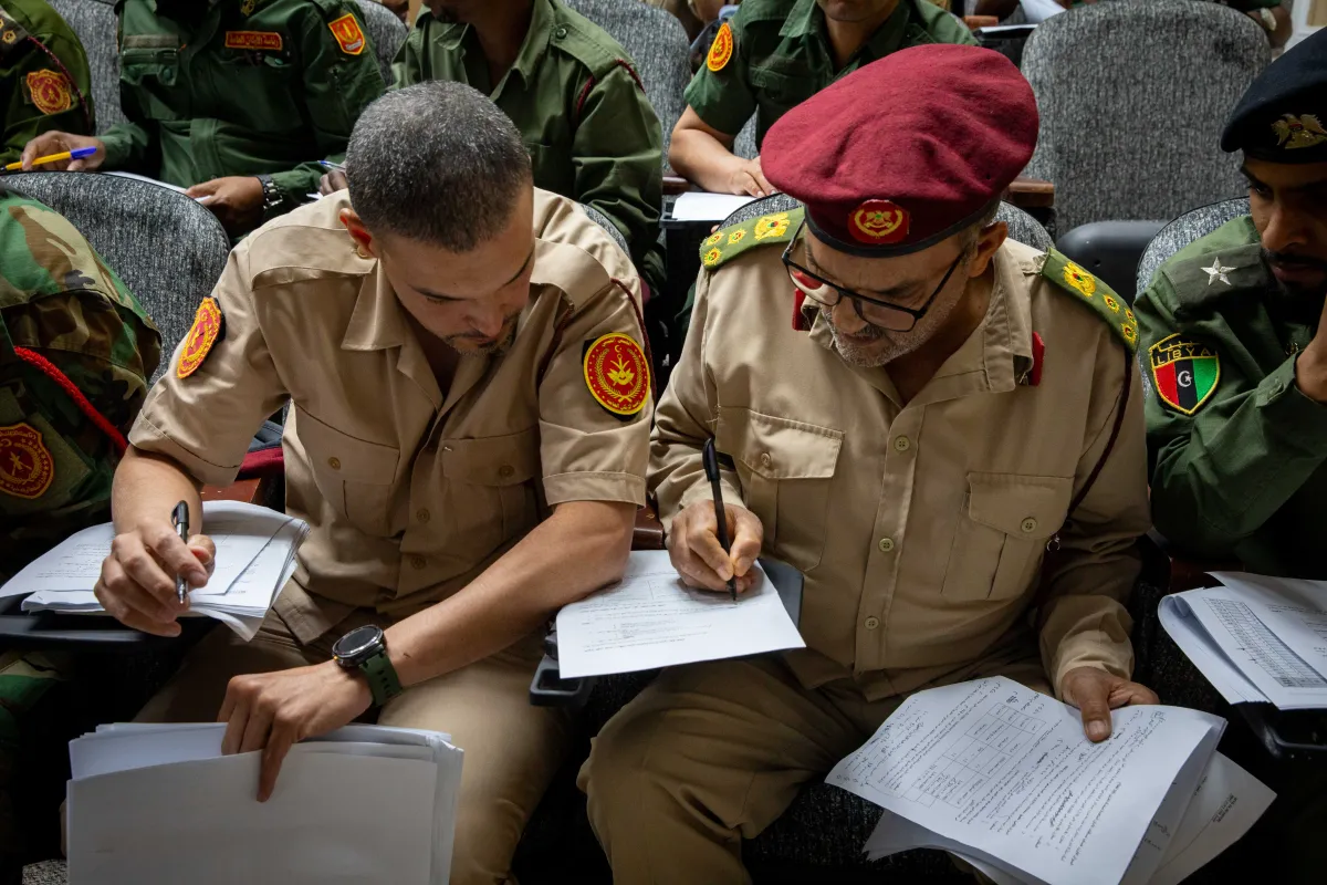 Officers learn about weapons and ammunition management in a classroom at the Ministry of Defence