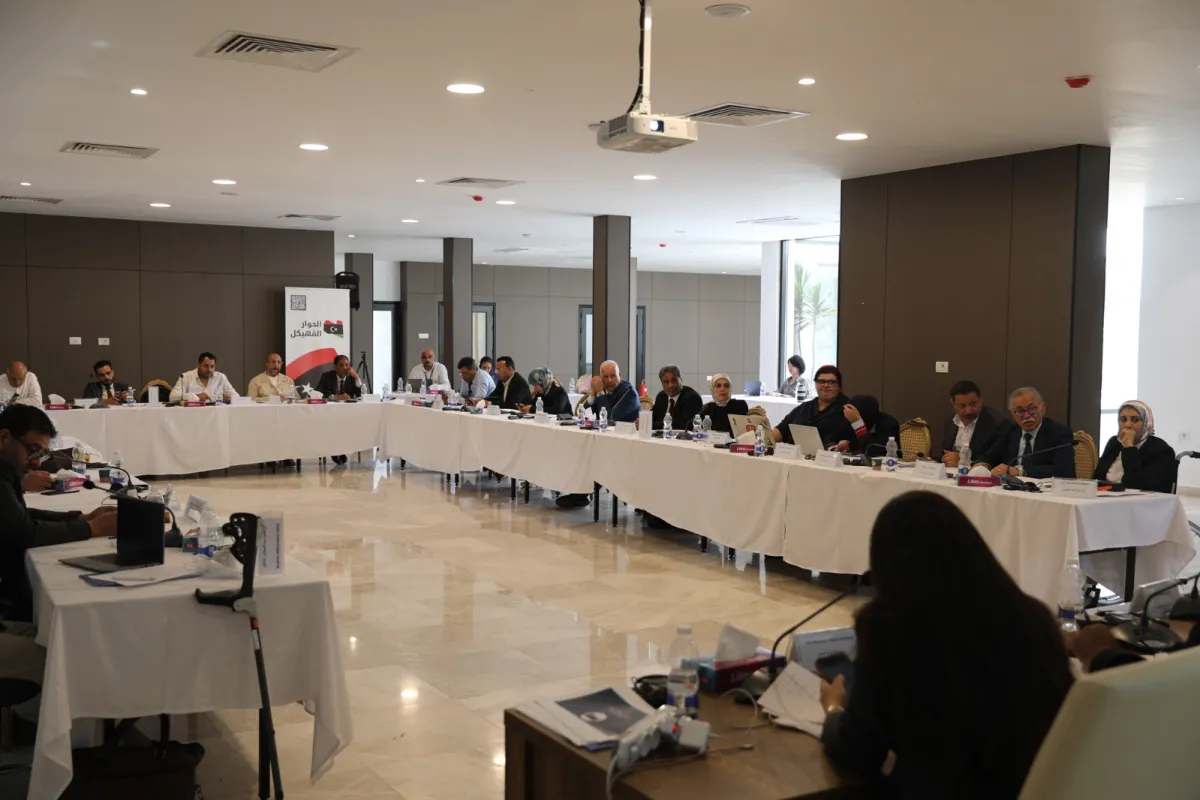 A view of the Governance Track members sitting around a table, discussing.