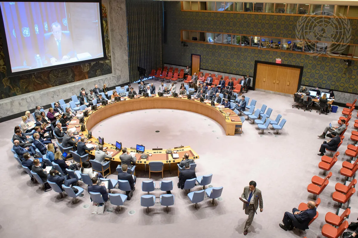 A wide view of the Security Council Chamber as Martin Kobler (shown on screen), Special Representative of the Secretary-General and Head of the UN Support Mission in Libya (UNSMIL), briefs the Council via video teleconference.