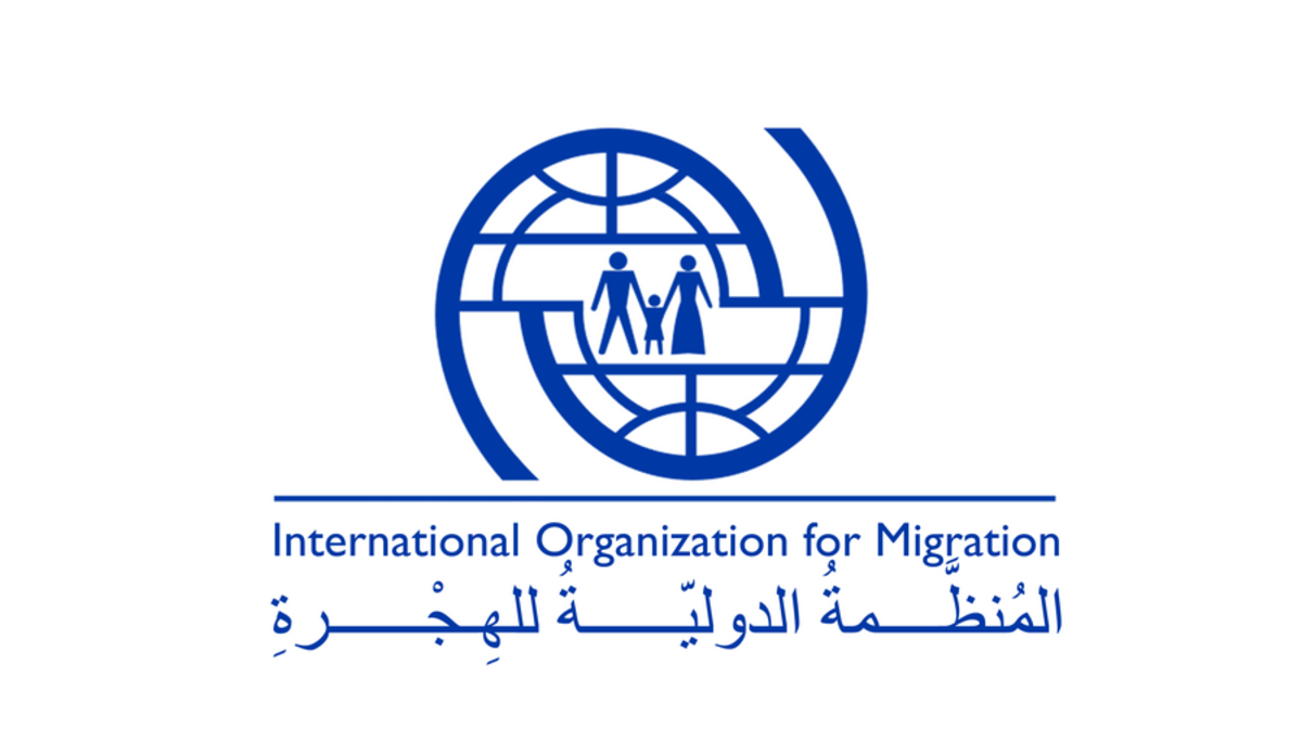 Оон миграция. IOM лого. Международная организация по миграции мом. Международная организация по миграции история создания. Логотип Международная организация по миграции (мом).